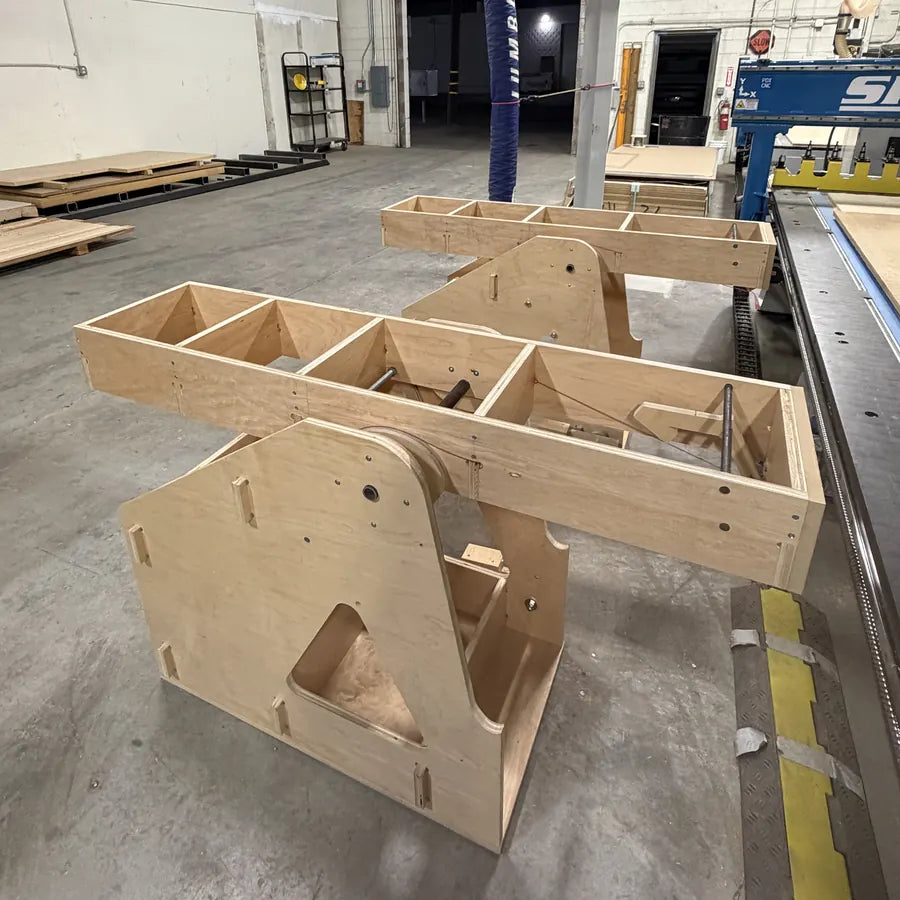Both Sheet Flipper wings pushed level beside a ShopSabre IS510 CNC table