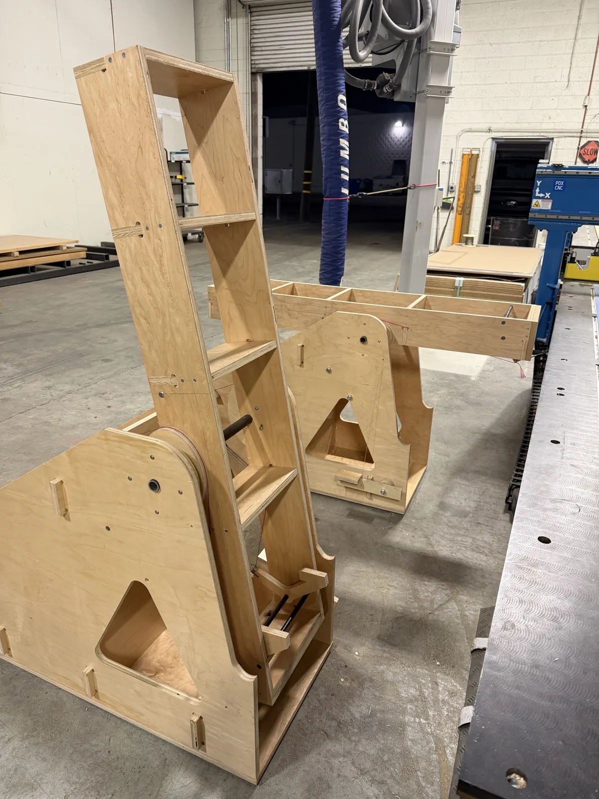 One wing pushed level and latched while the other stands at rest.